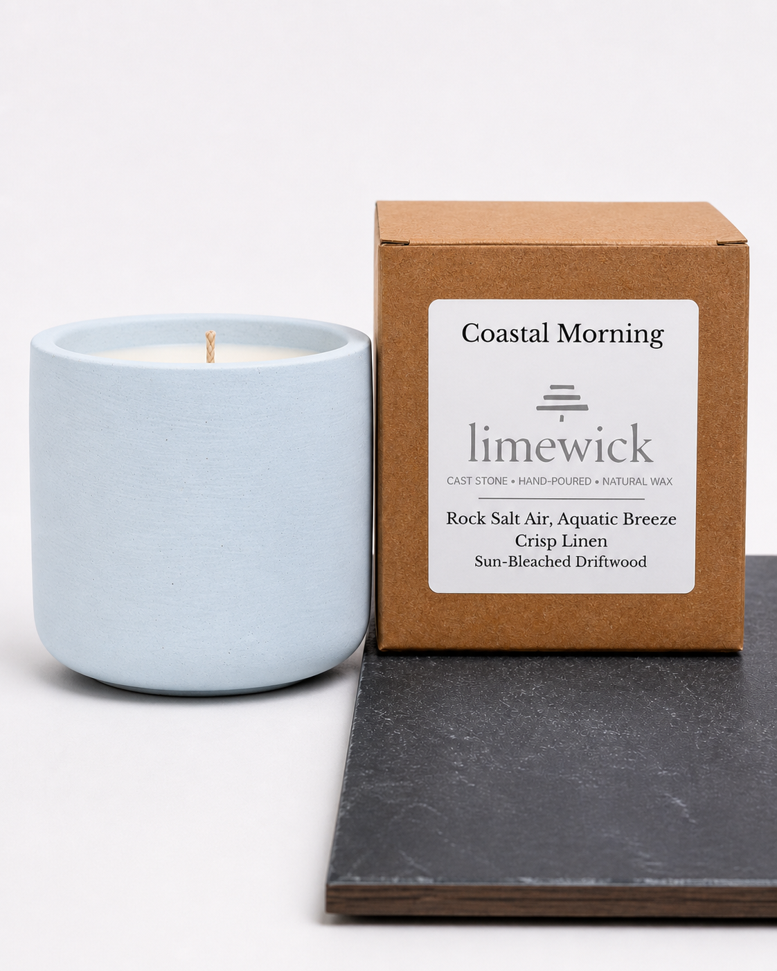 Limewick Coastal Morning natural wax candle in pale blue cast stone vessel with kraft gift box